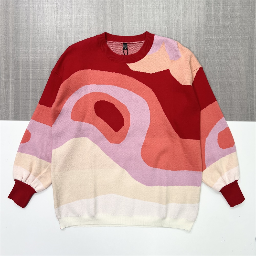 Женский вязаный свитер с многоцветным абстрактным рисунком (красные и пастельные тона)